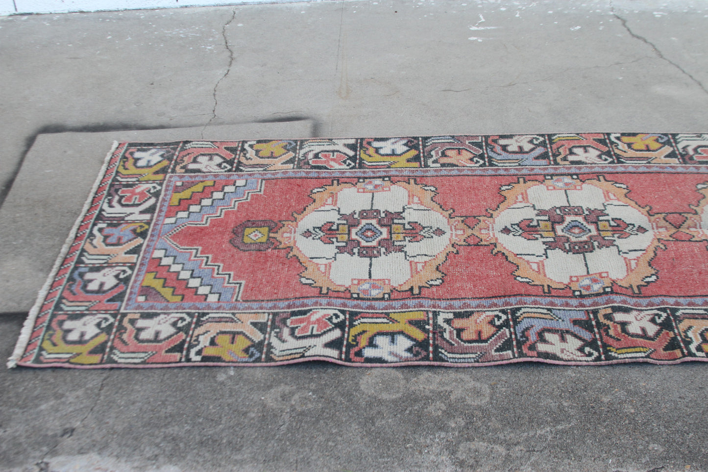 Oriental pink rug with central medallion floral motifs