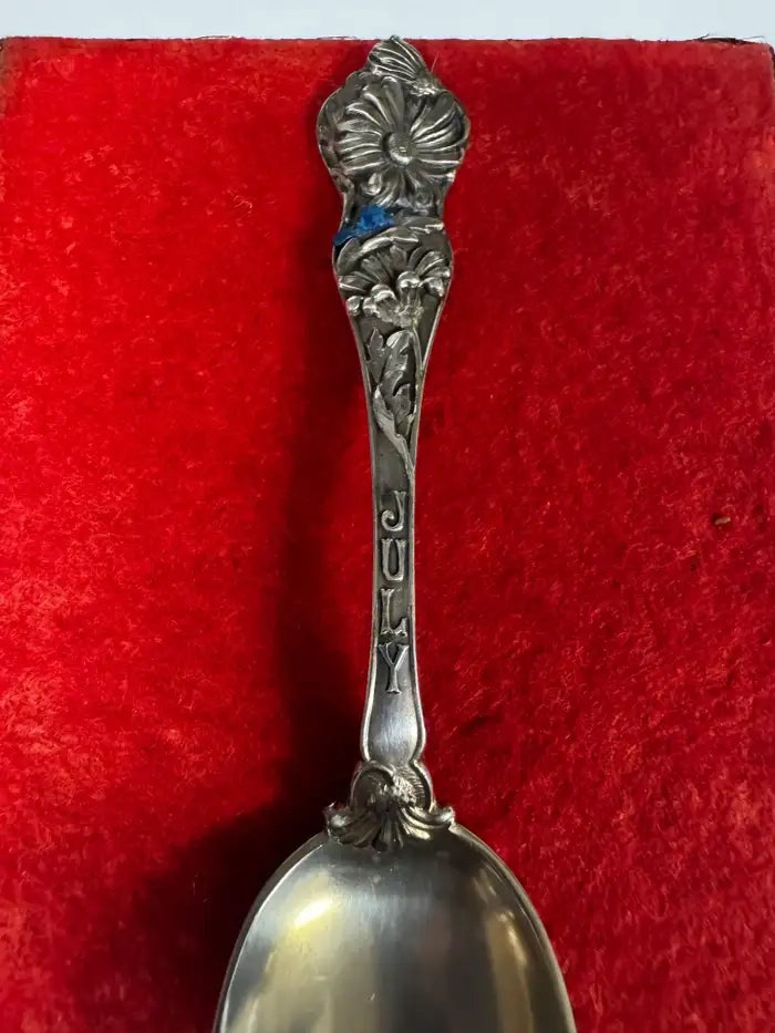 Polished silver spoon floral detail