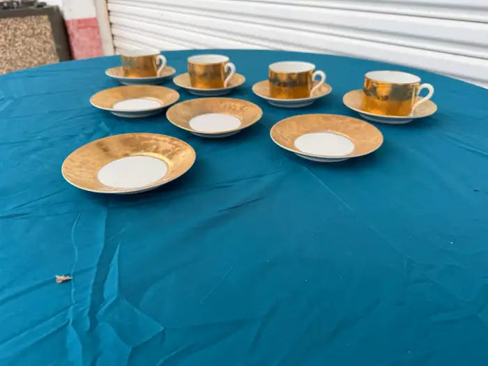 Porcelain tea set close up gilt rim detailing antique tableware