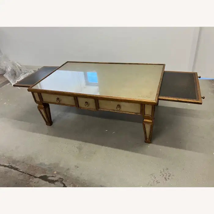 Designer glass top coffee table with carved wood base