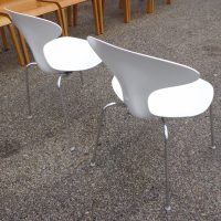 Stackable Orbit dining chairs with modern curves