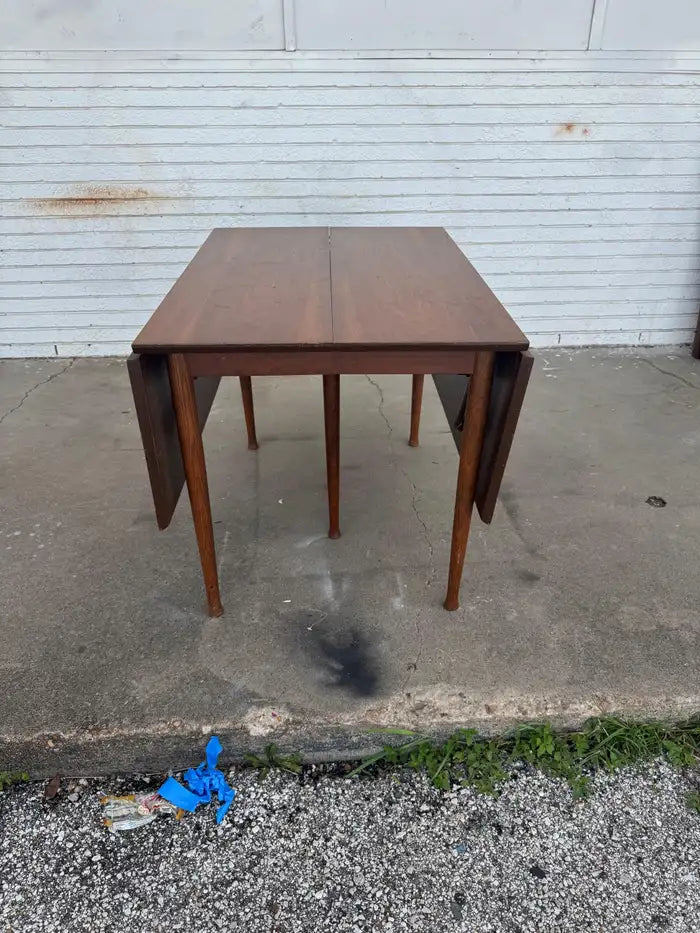 Large expandable wood dining table with folding leaves
