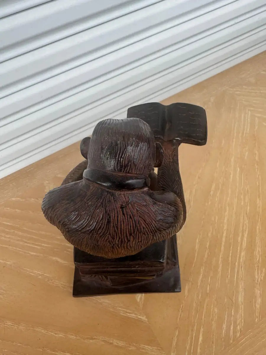 artistic monkey sculpture with thoughtful seated pose