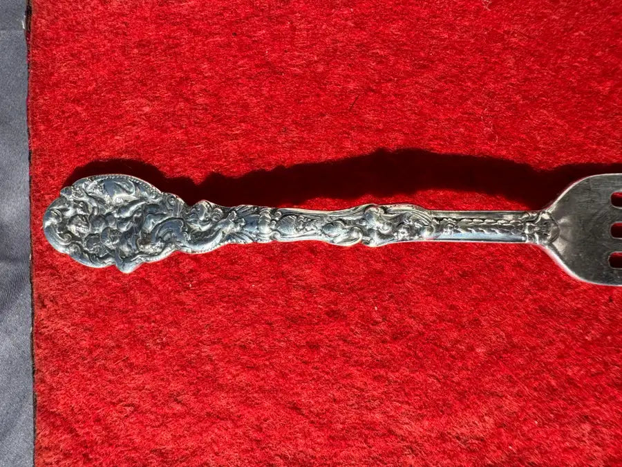 antique fork with detailed engraving and smooth tines