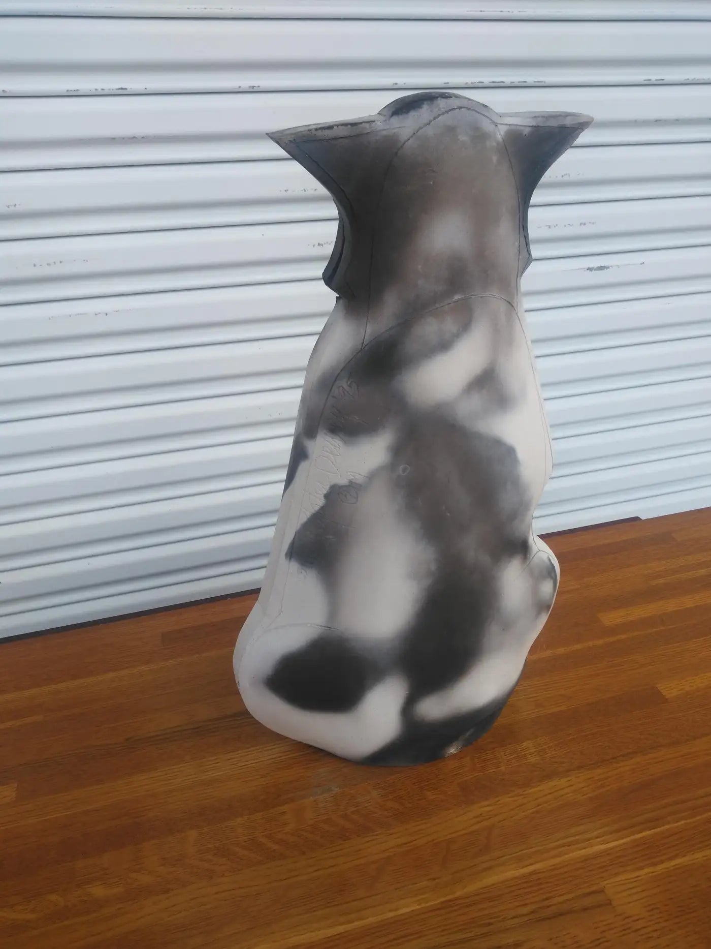 Raku-fired ceramic cat with minimalist lines
