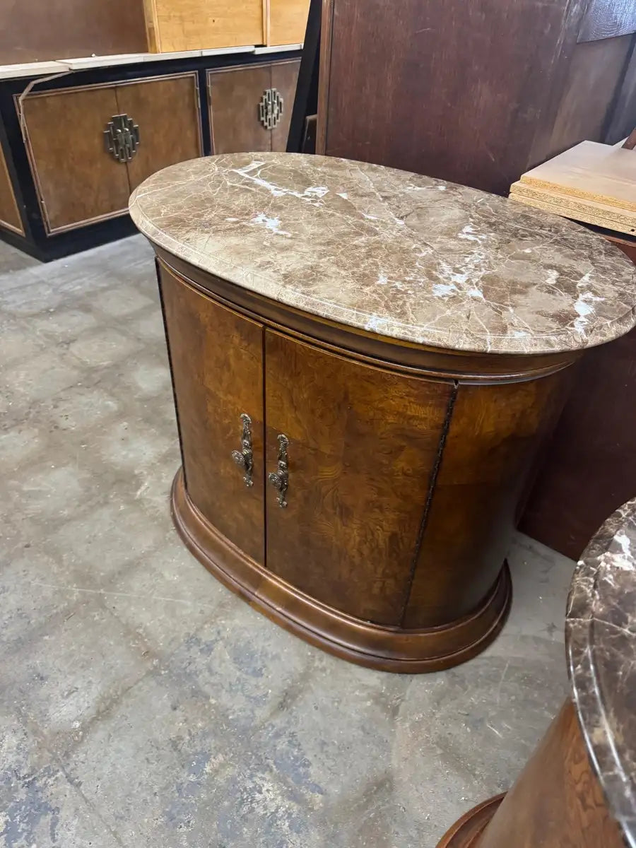 vintage style accent cabinet with marble top and curved edges