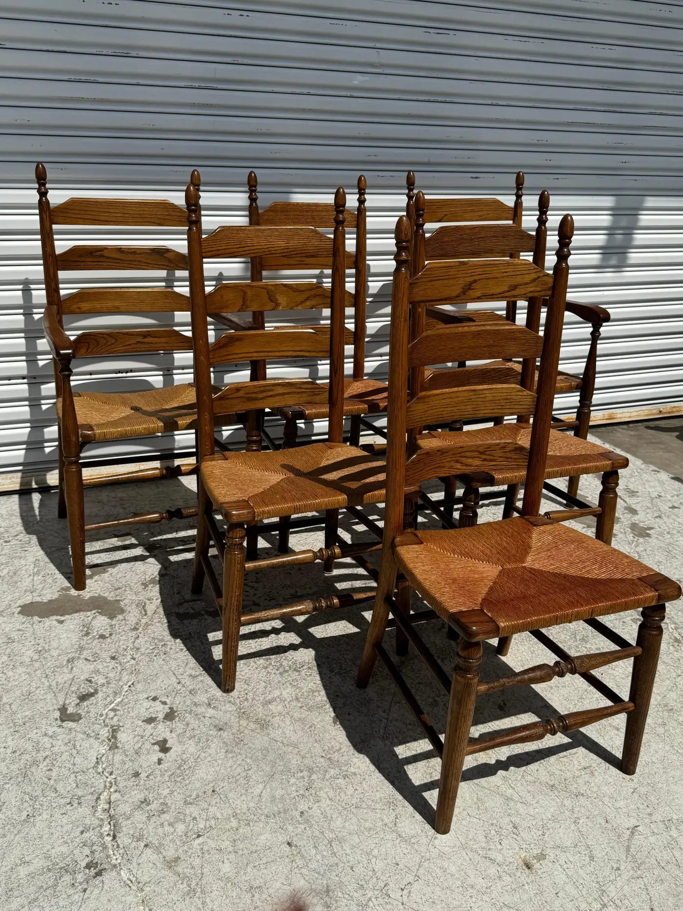 Antique ladderback dining chair with natural rush seat