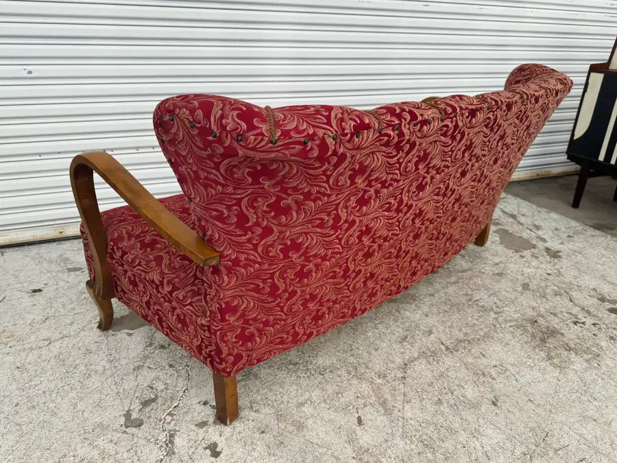 vintage curved sofa with natural wood grain detailing