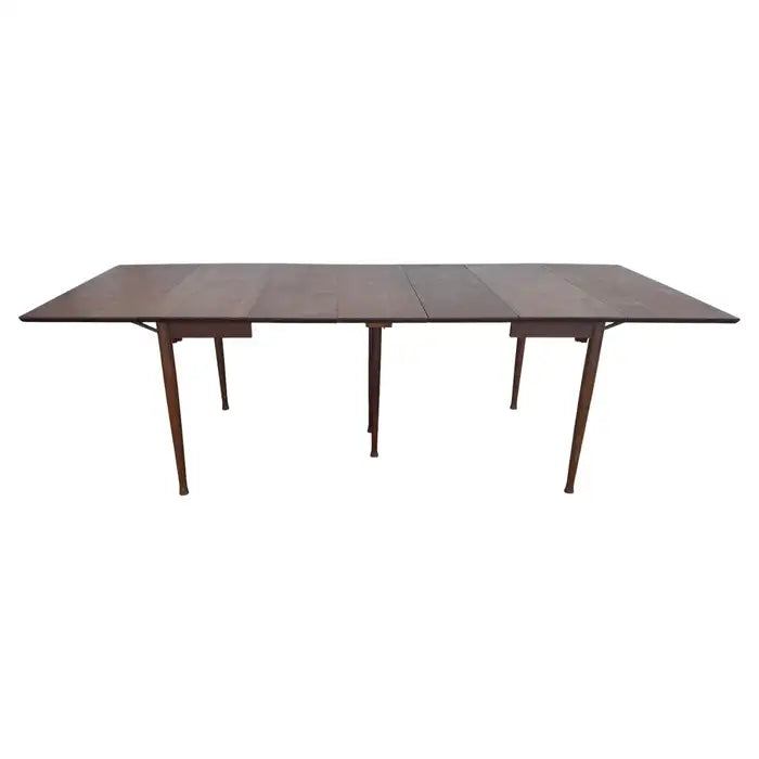 Expandable walnut dining table with drop leaf design