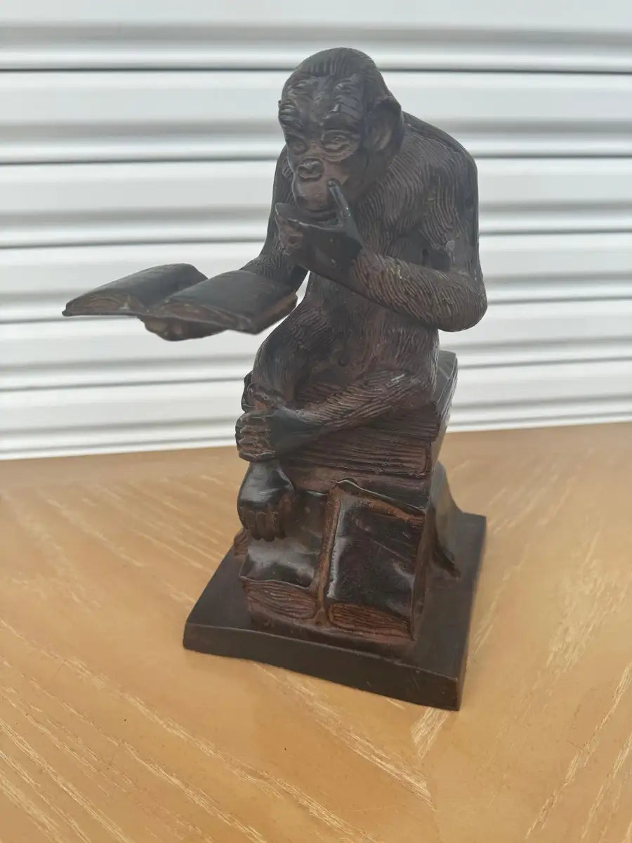 thinker style monkey sculpture with classic bronze tone