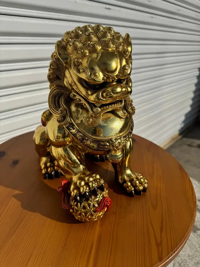 Foo dog with red ball statue