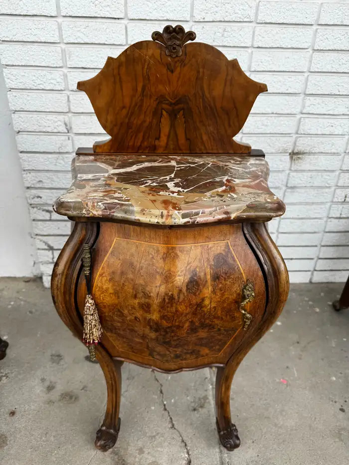 classic bombe nightstands with detailed veneer inlay and marble tops