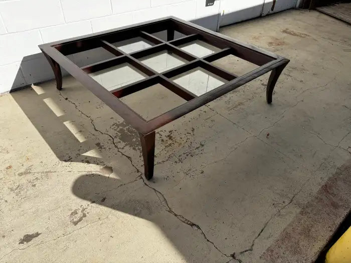 Modern wood coffee table with glass panels