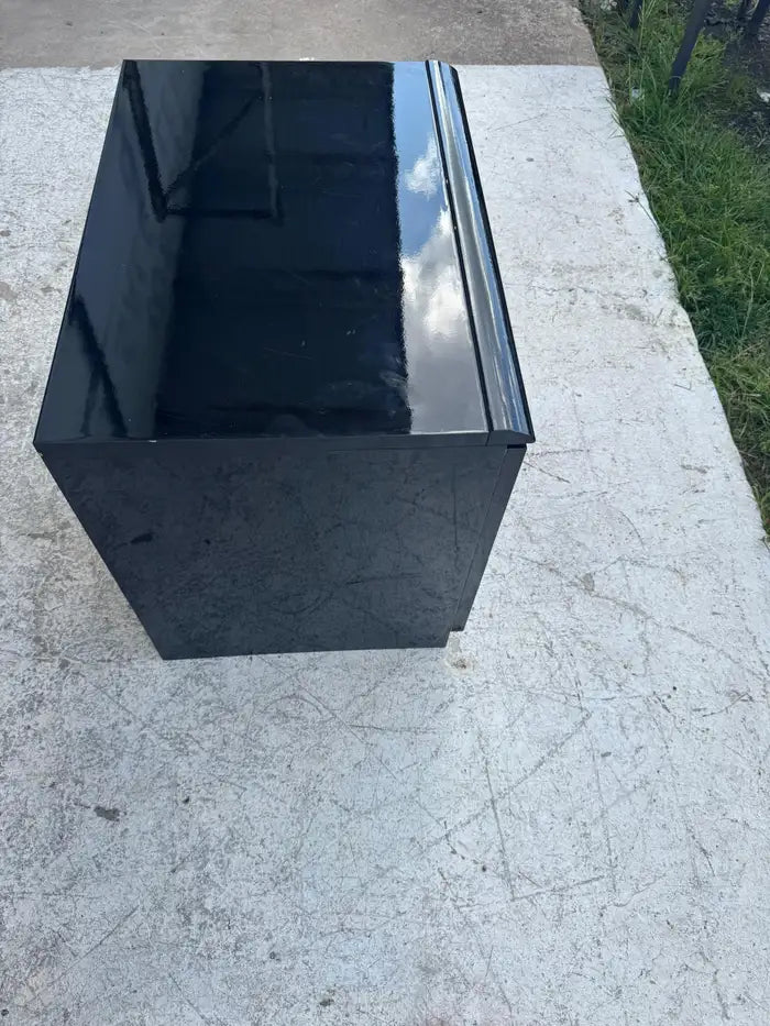 Gloss black bedside table with contemporary design
