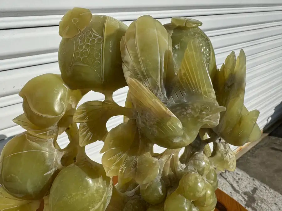 Green jade stone sculpture grapes and bird motif