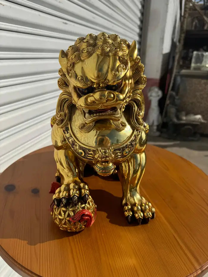 Foo lion with paw on ball