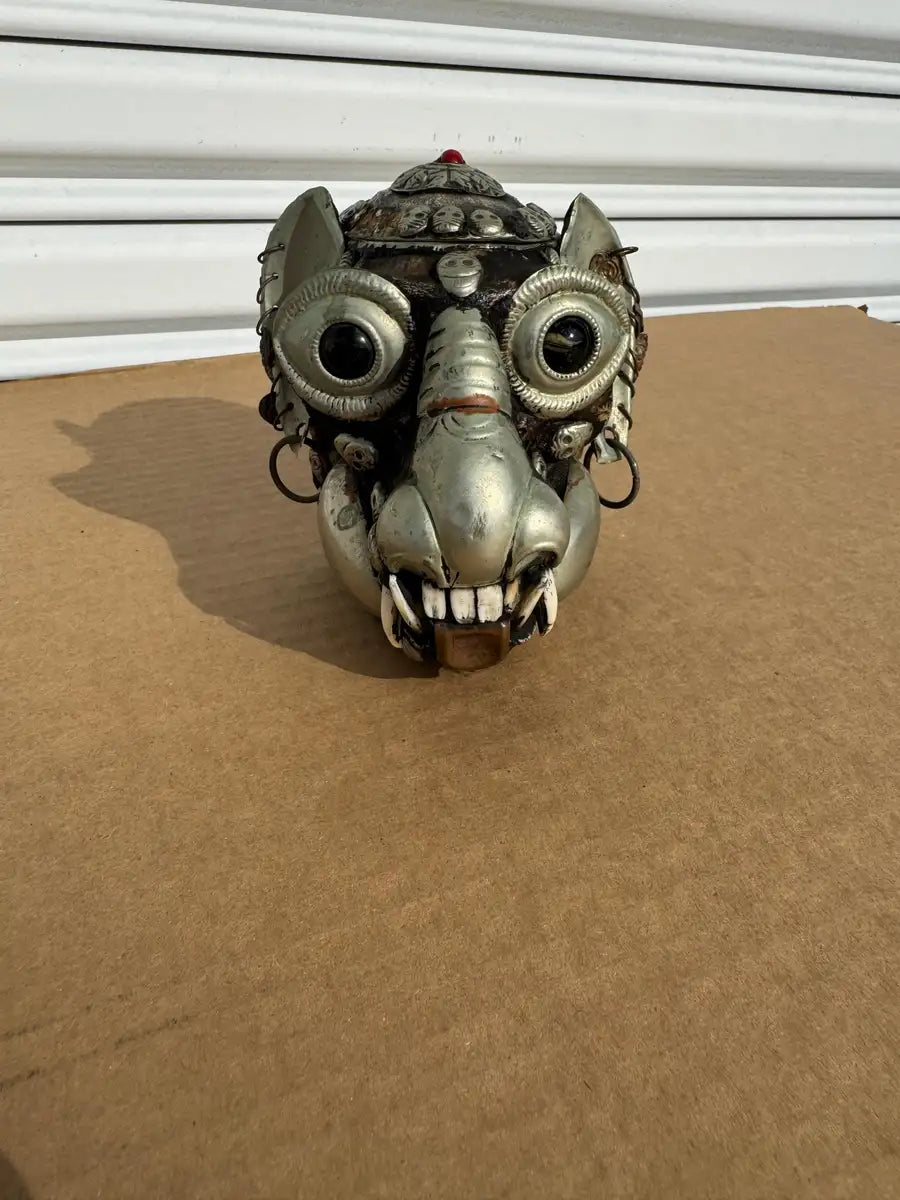 carved skull decor with tribal Tibetan design