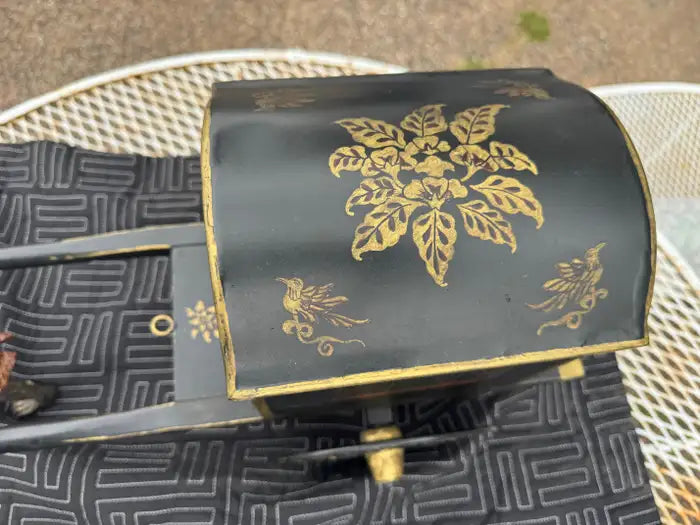 Vintage monkey sculpture with ornate metal cart details