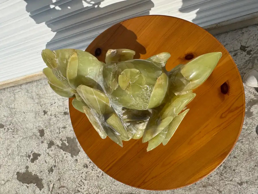 Natural jade decorative sculpture with detailed bird carving