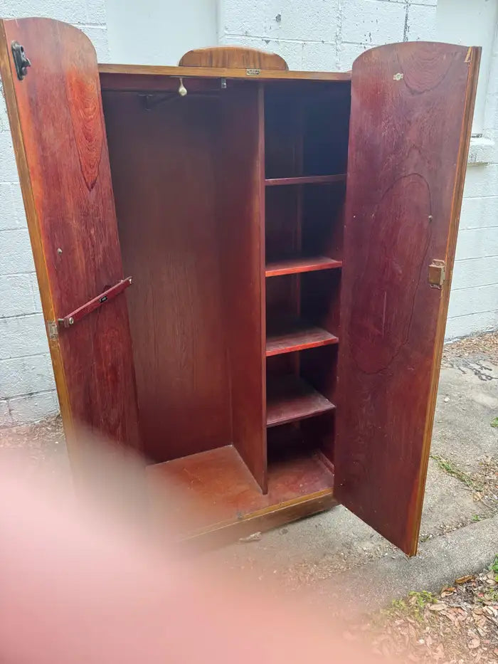 Handcrafted vintage wardrobe cabinet with rich wood grain