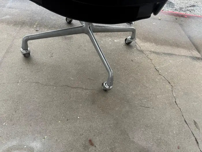 Mid-century executive seating with premium black leather upholstery