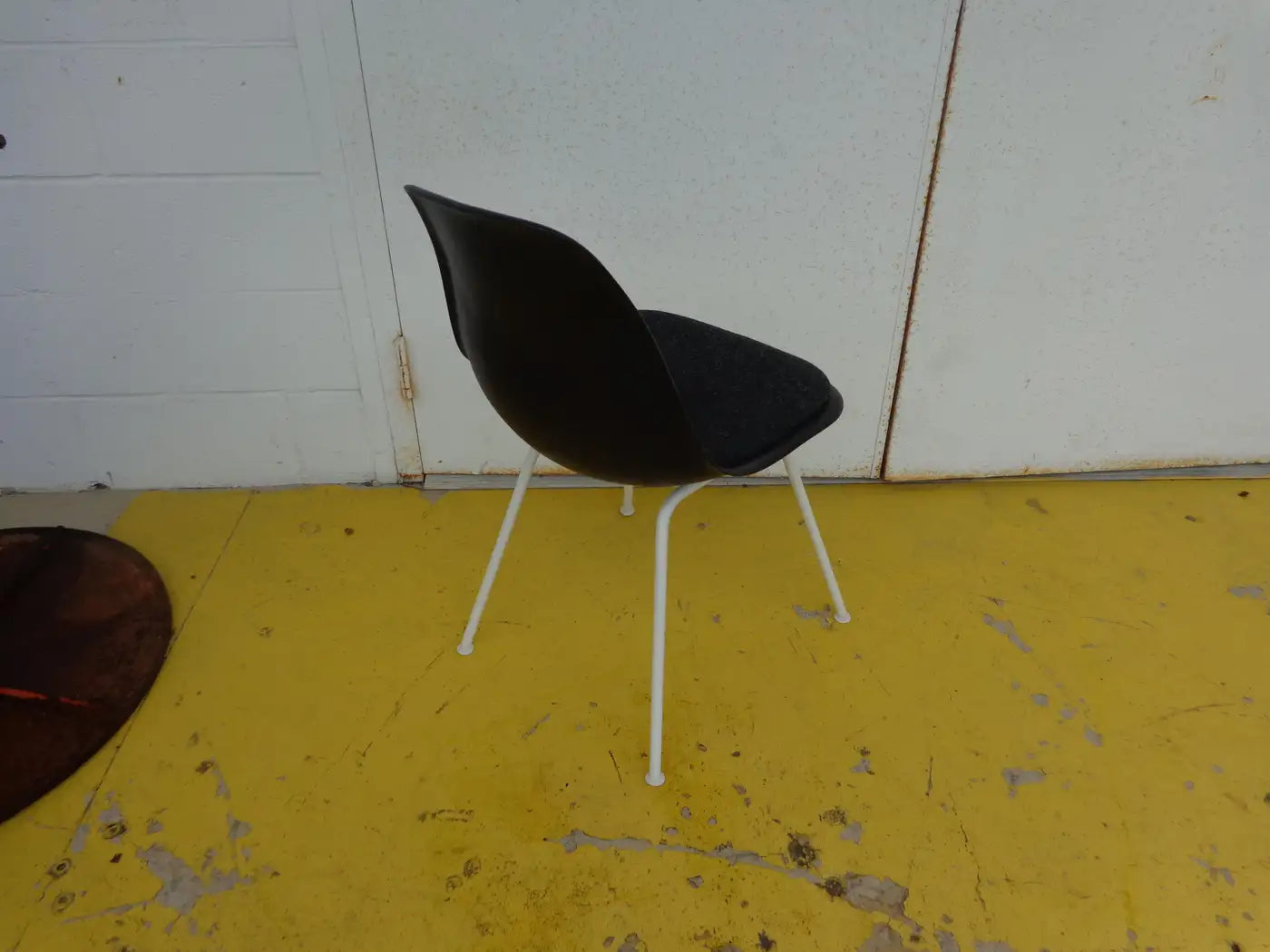Modern stackable Eames plastic chairs