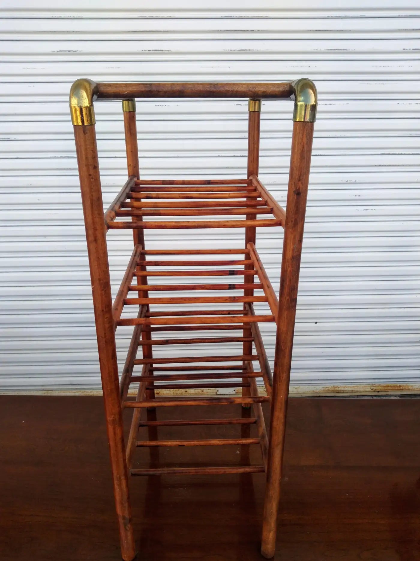 Stylish brass and bentwood wine stand