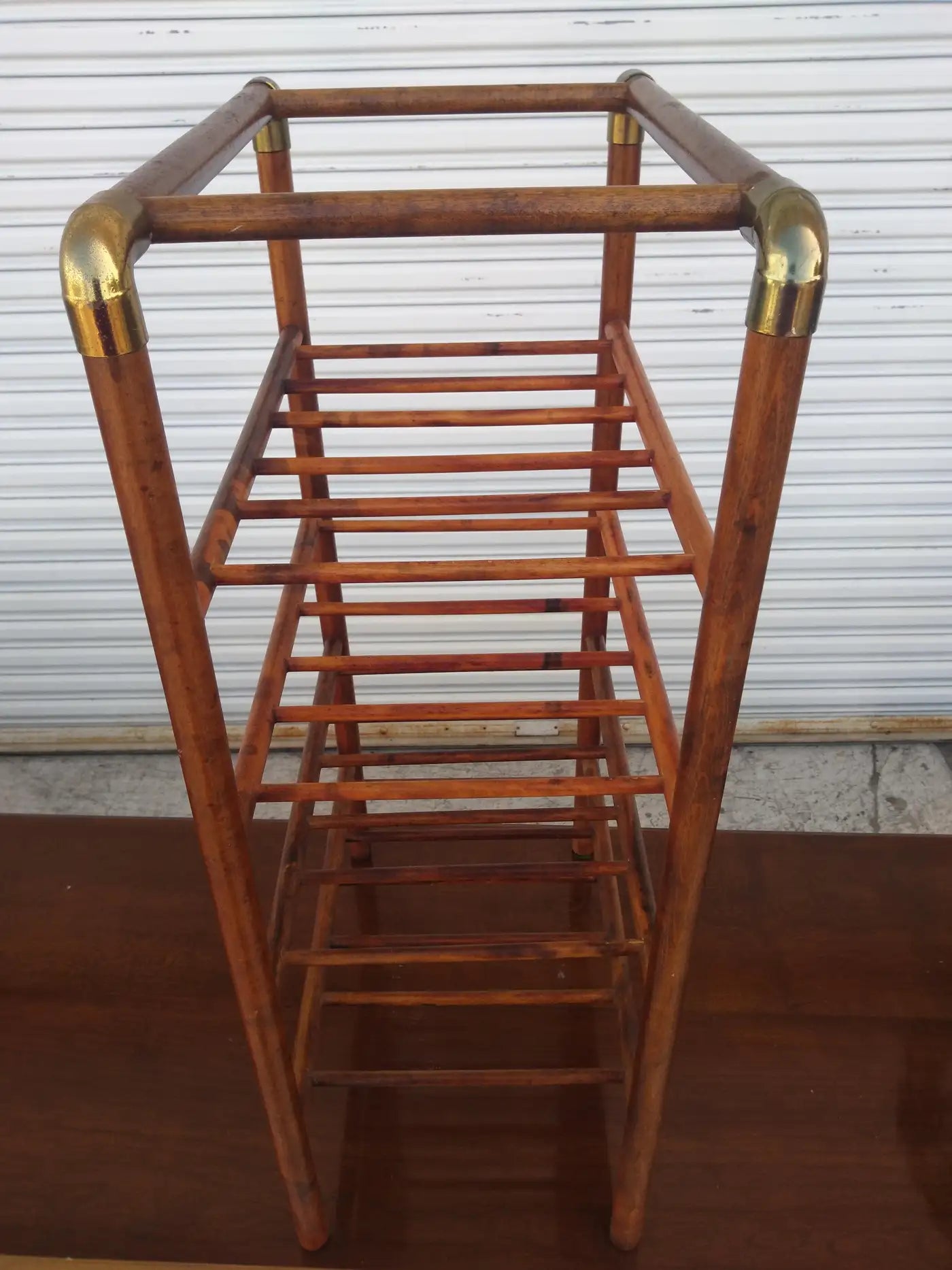 Wooden wine bottle rack with brass touches