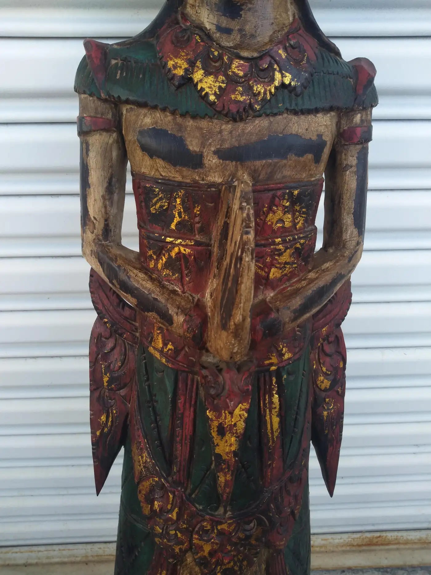 Spiritual Balinese wood carving of deity