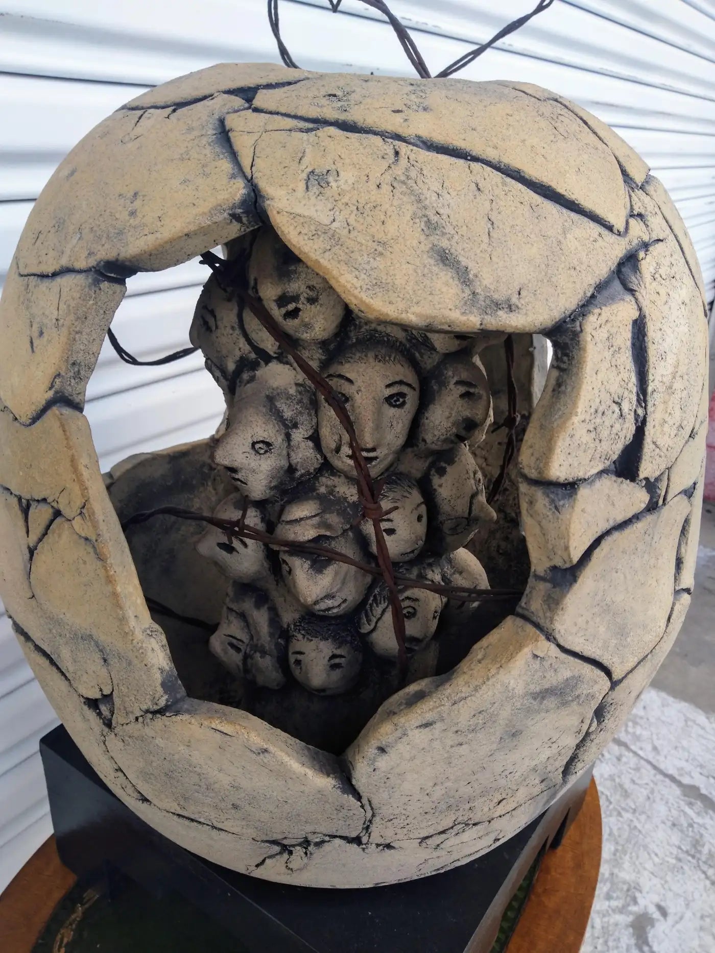 Handcrafted Raku-fired sculpture with symbolic design