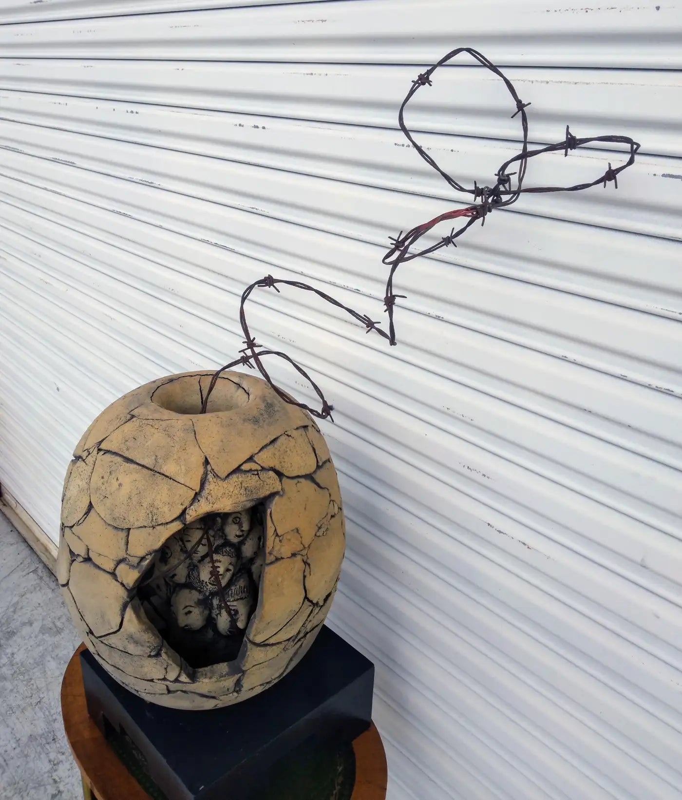 Contemporary Raku pottery sculpture titled In Search of Wisdom