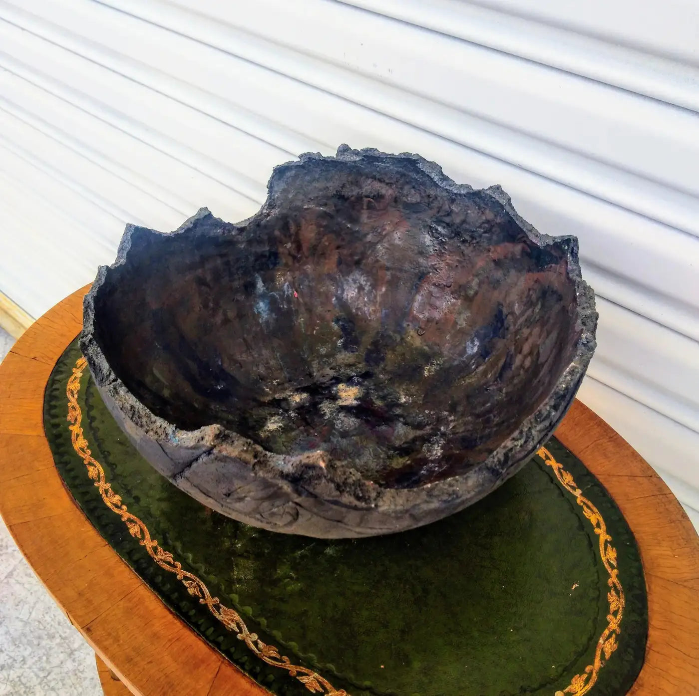 Raku pottery bowl with unique glaze