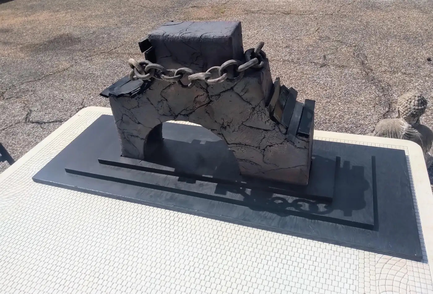 Large architectural art piece on 3-tiered base