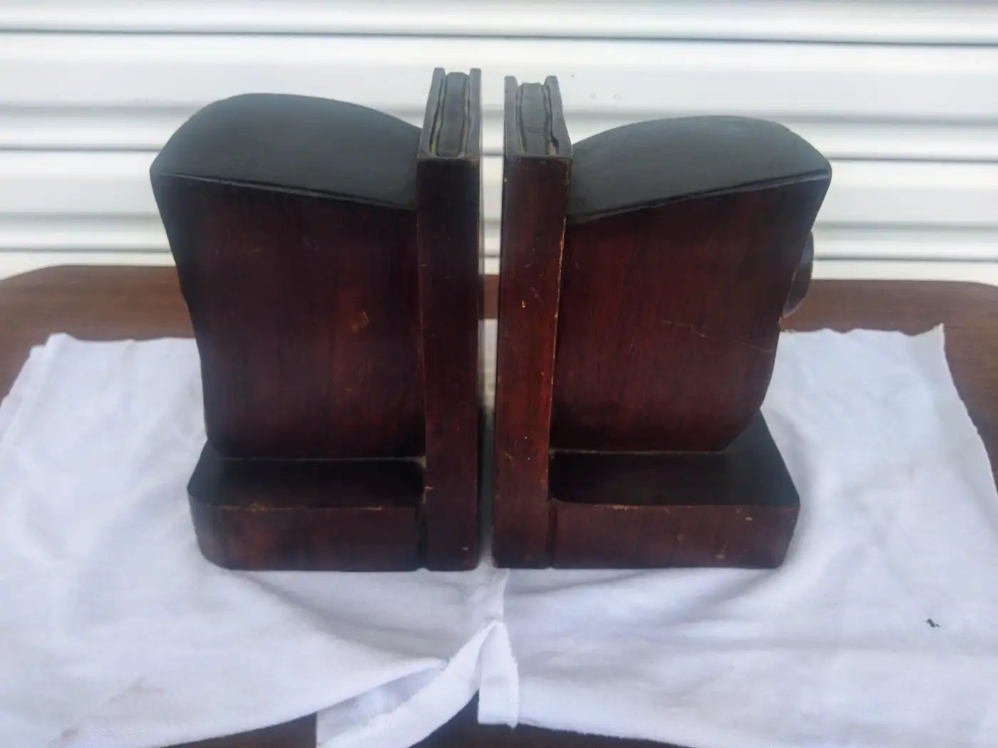 Theater mask bookends on shelf