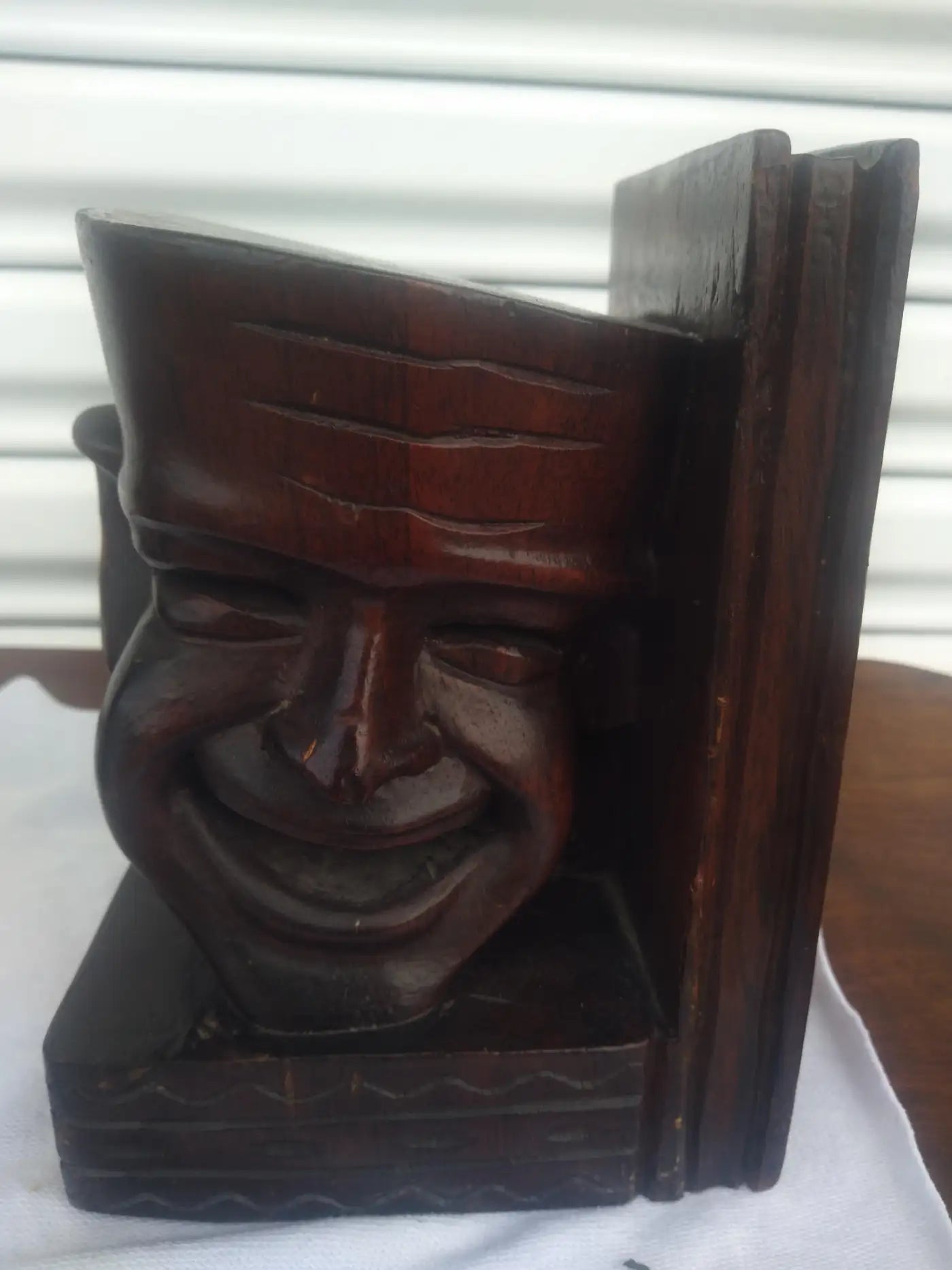 Pair of wooden bookends with comedy and tragedy faces