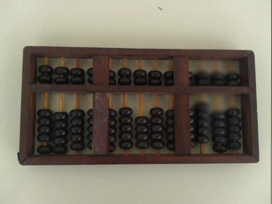 Lacquered abacus with brass accents on wooden frame