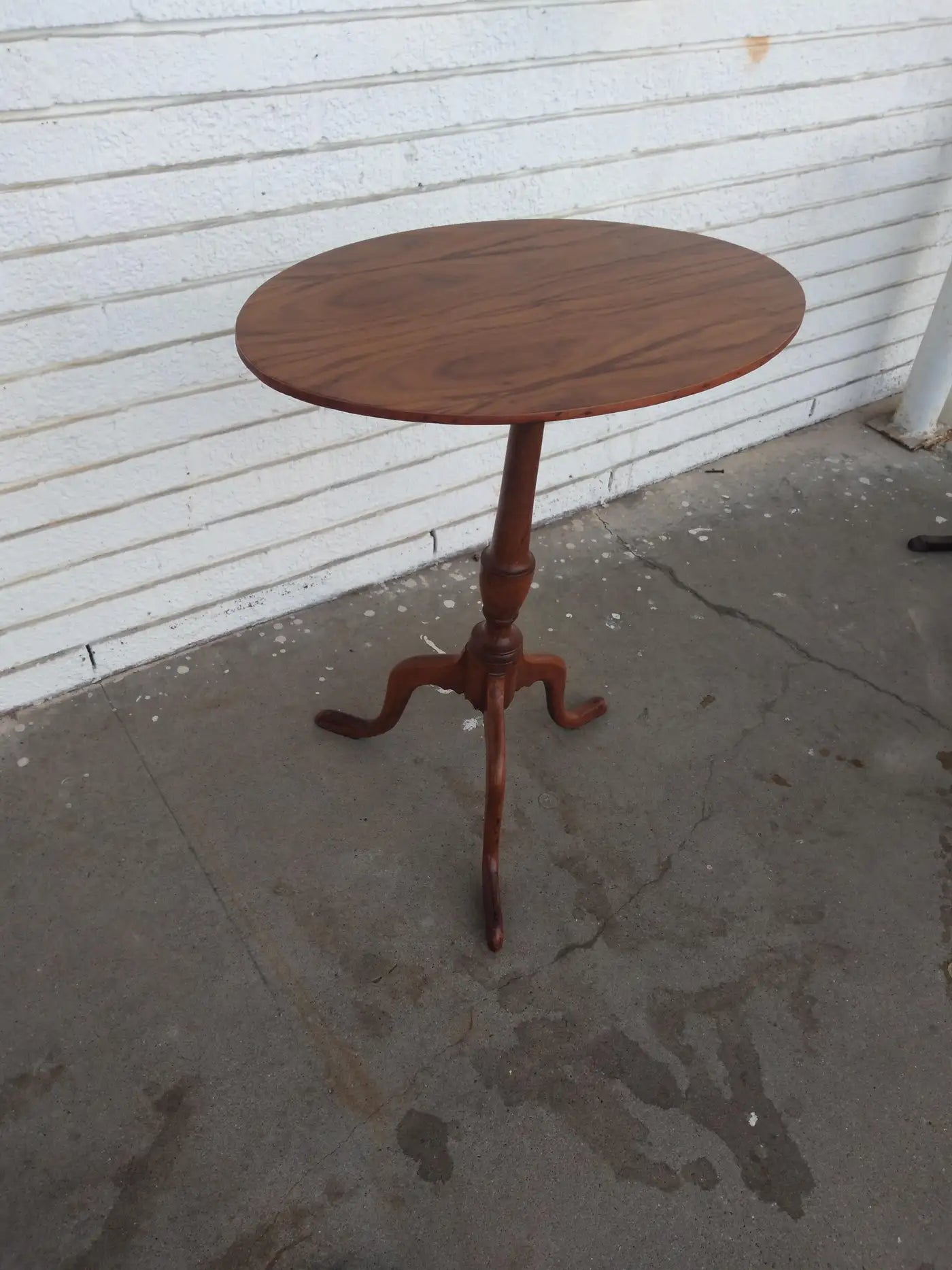Antique candle stand with tripod base