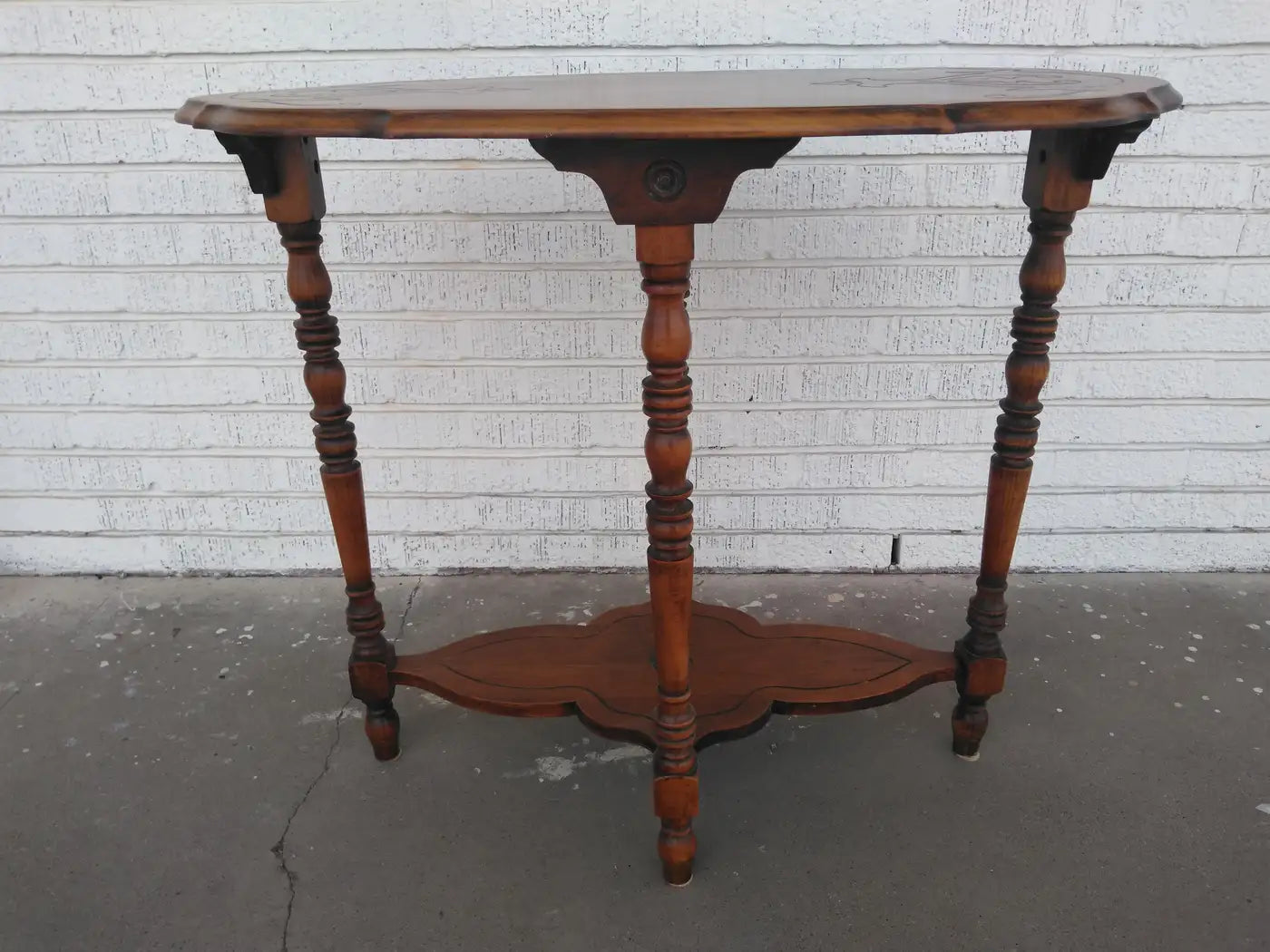 Edwardian walnut side table with detailed woodwork