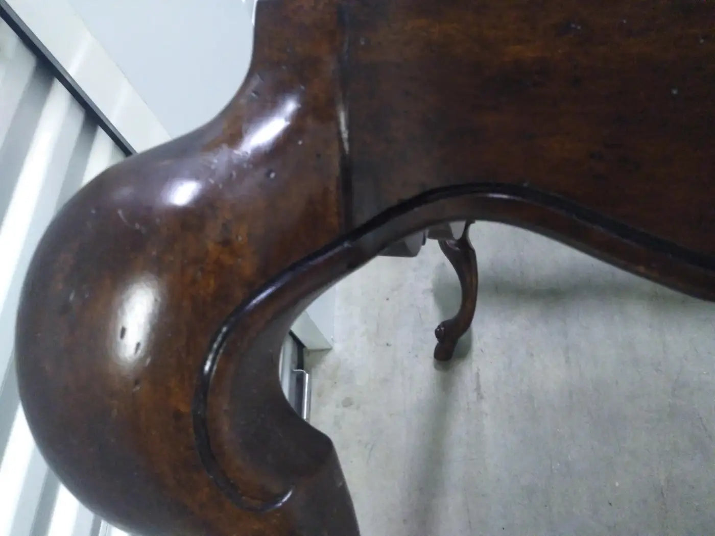 Glass top coffee table with walnut swan legs design