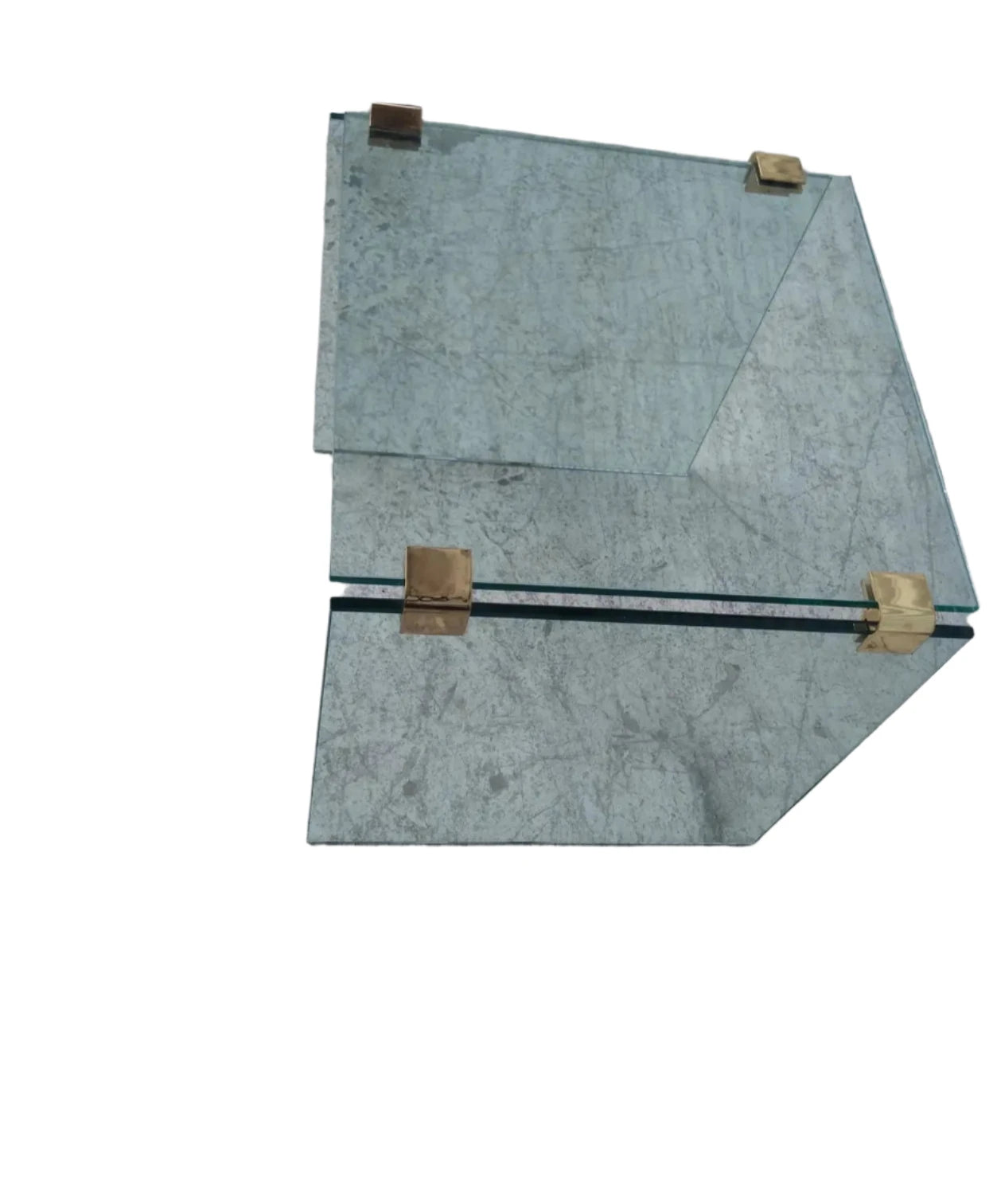 Brass accented glass table for modern decor