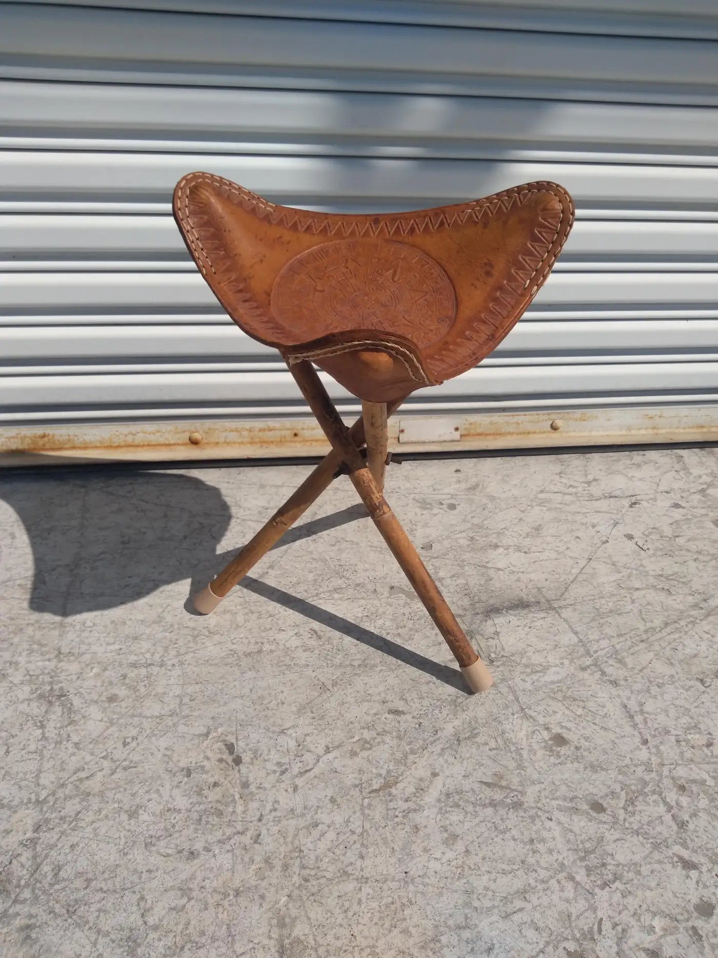 Boho style bamboo stool with tripod legs