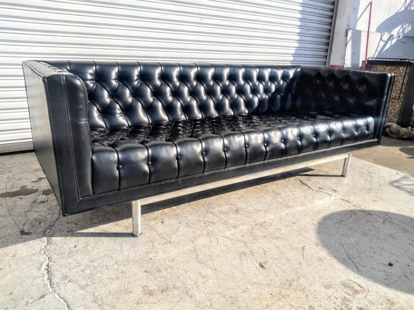 Tufted faux leather sofa with classic MCM style