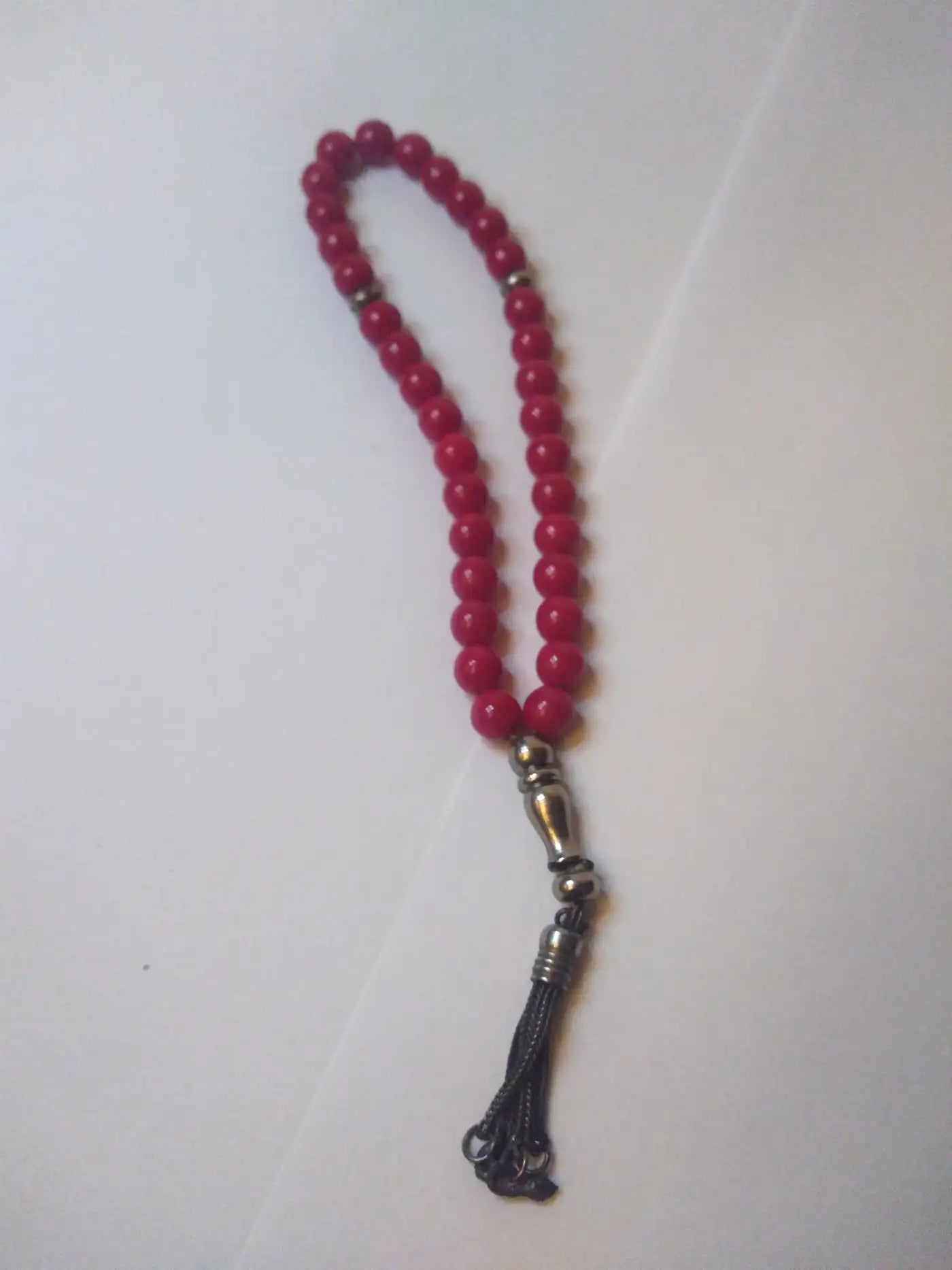 Handcrafted red meditation beads with silver accents