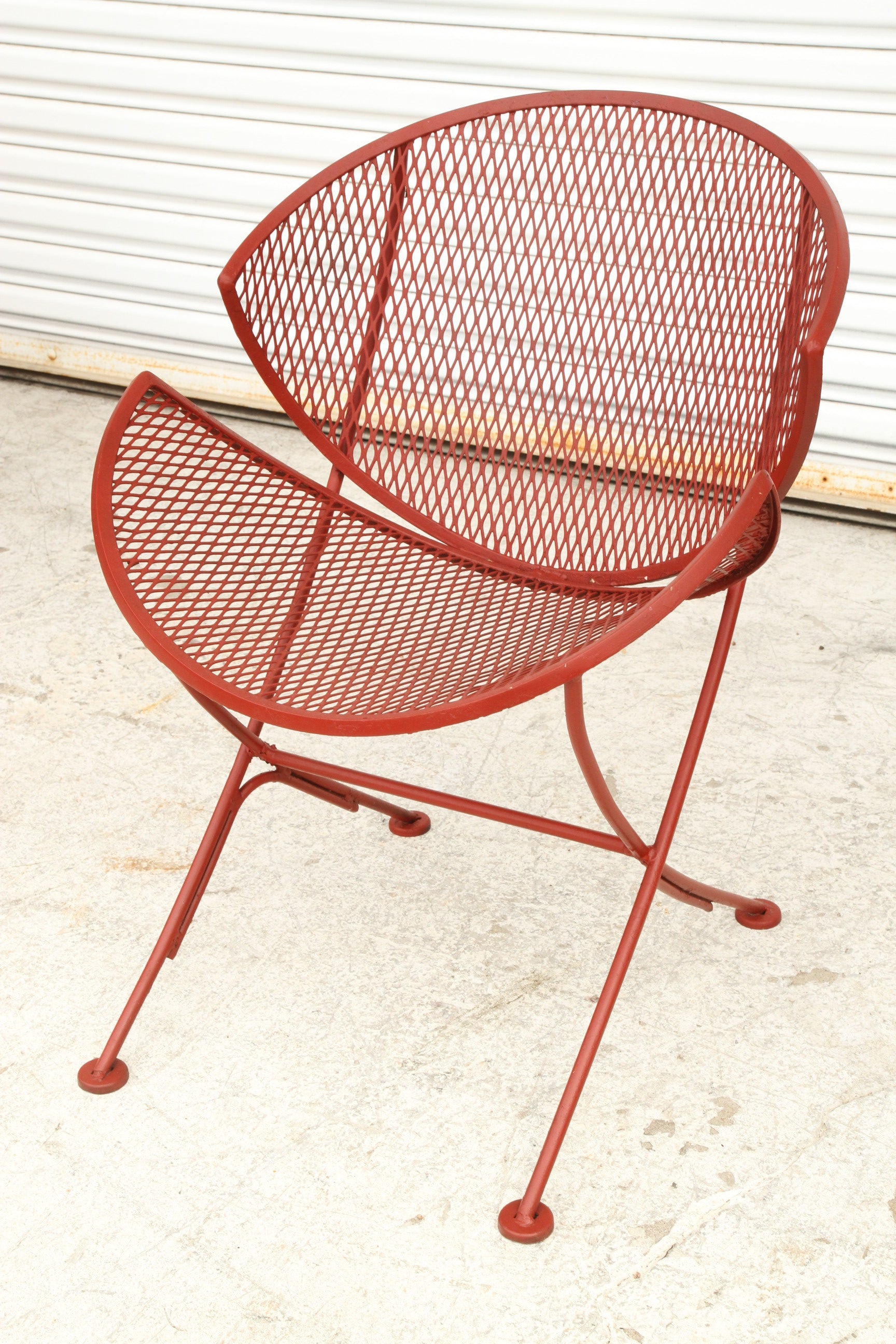 Orange Slice Chairs from Salterini by Maurizio Tempestini. Characterized by their unique slice-shaped seats and bold orange color, these chairs bring a sense of whimsy and elegance to modern interiors.