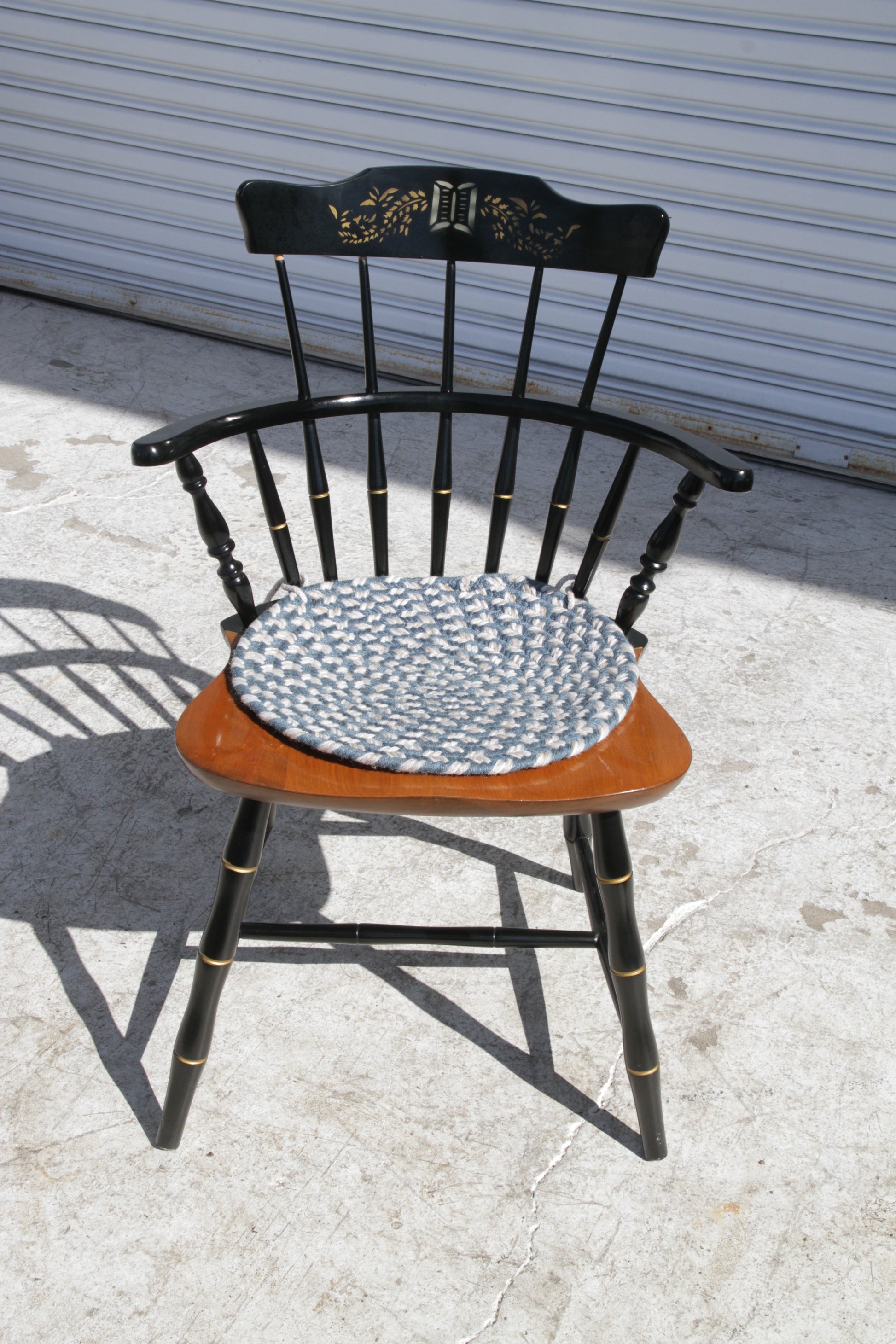 Traditional spindle back Windsor chair for dining rooms, kitchens, or rustic spaces.