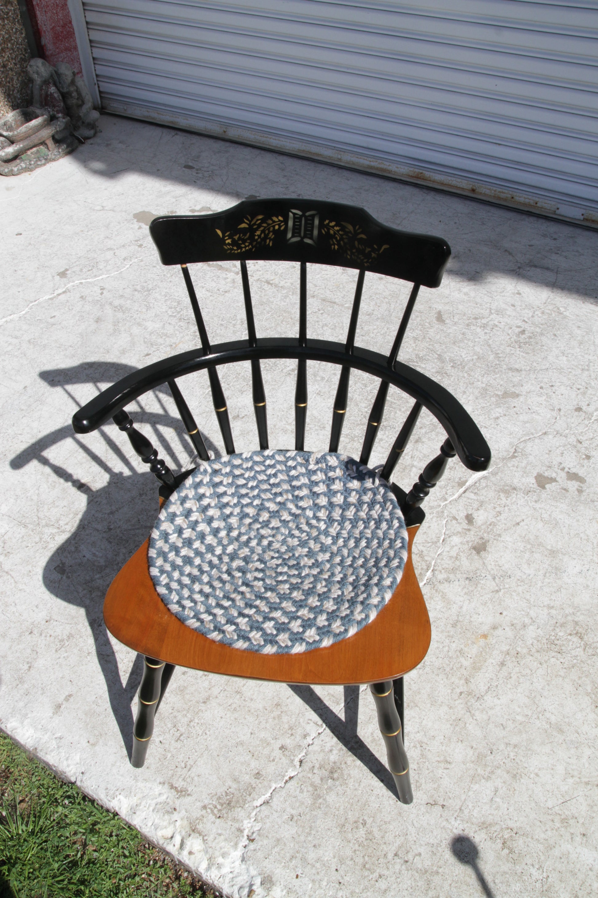 Black spindle back Windsor chair, perfect as a dining chair or accent piece.