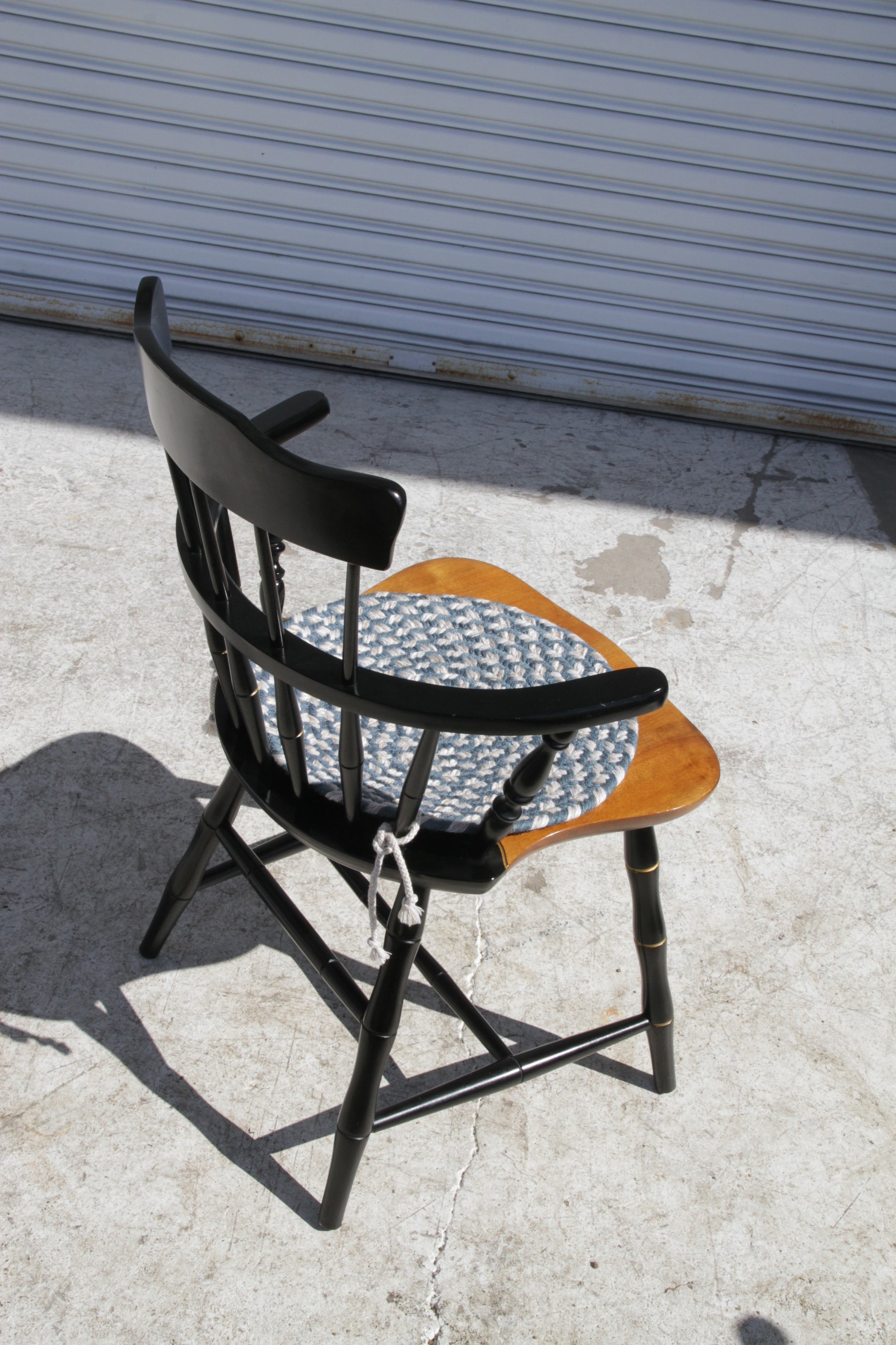 Solid wood spindle back chair in Windsor style for a cozy, country-inspired dining room.