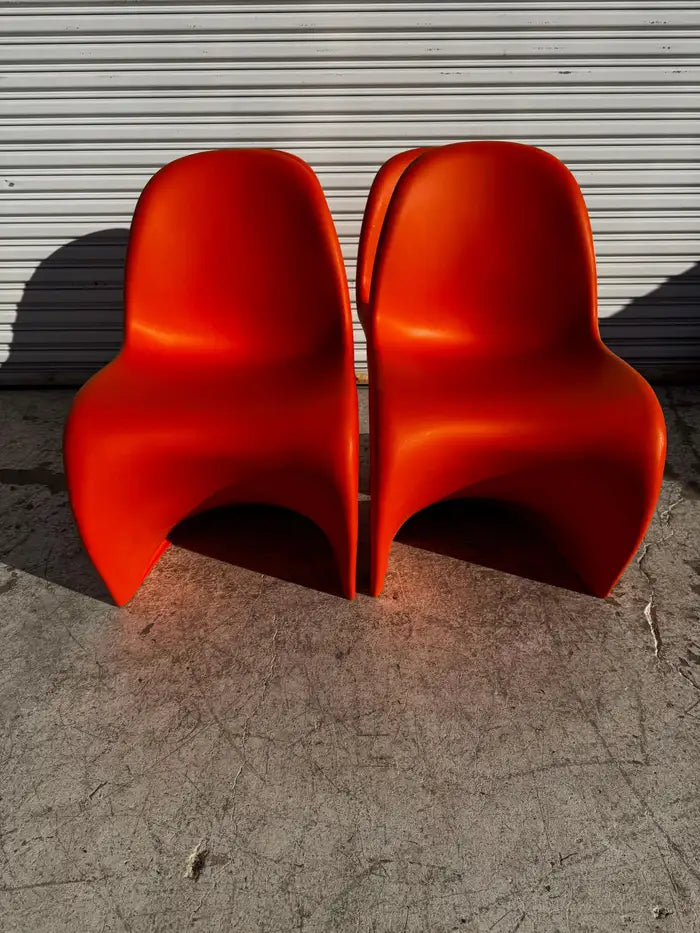 Vitra stackable molded plastic dining chairs