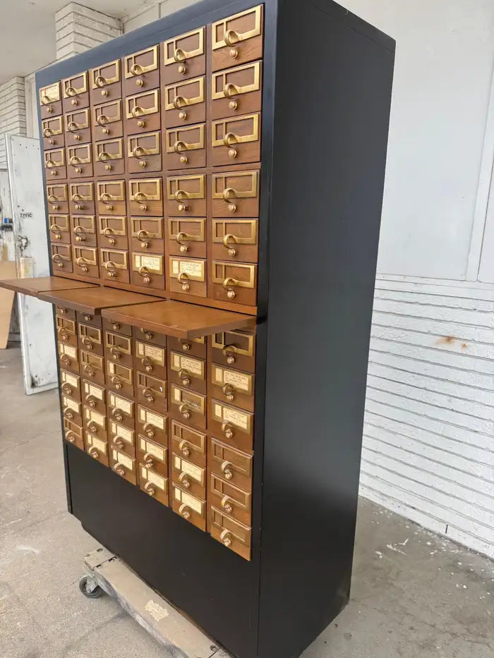 Antique apothecary cabinet with multiple storage drawers