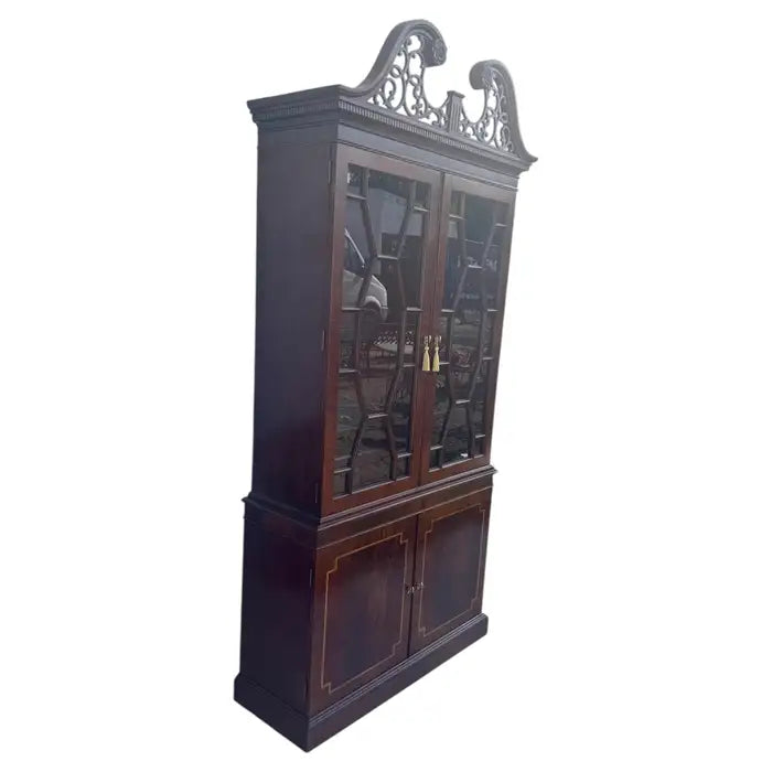 Mahogany display cabinet with glass doors and traditional detailing